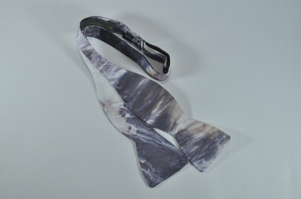 self tie bow tie with swirling colors of grey, brown black and white.