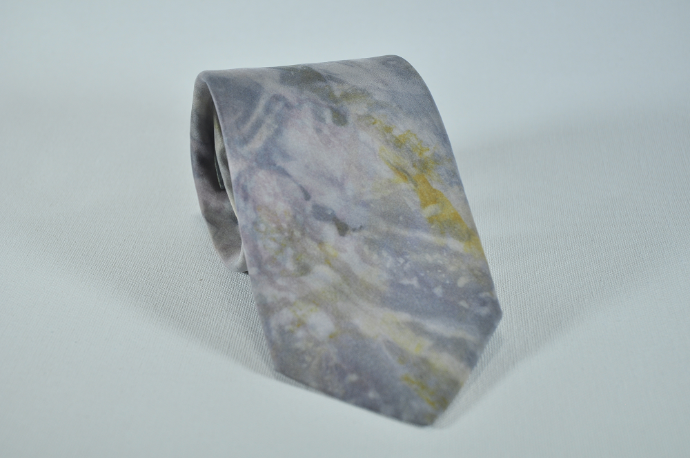 grey neck tie with amber highlights